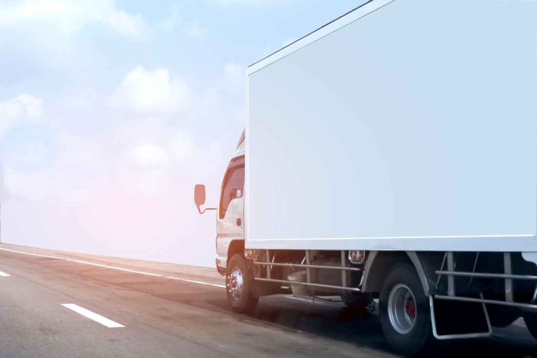 A moving truck on the highway for a long-distance relocation out of San Diego